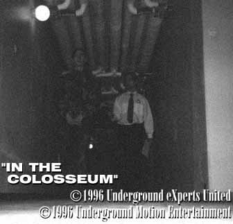 Two men walking in bunker, front