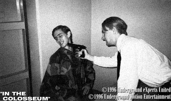 Man with gun under his chin